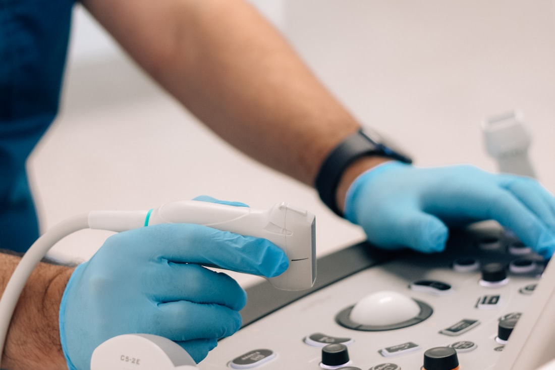 Clinician operating a modern diagnostic imaging console.
